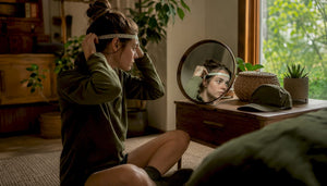 Person measuring head circumference for hat