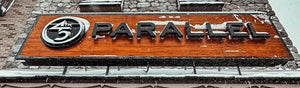 Snow falling outside the 45th Parallel store in Gaylord, Michigan, with a snowboarder wearing a 45th Parallel hoodie