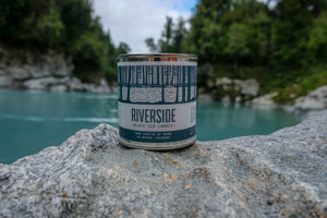 Northwoods Candle in Riverside by river