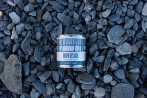 Northwoods Candle in Riverside on rocks