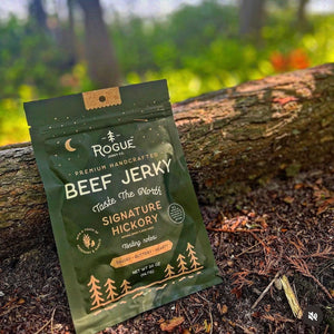 Rogue Jerky in Signature Hickory on log in woods