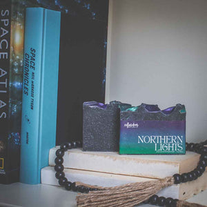 Cellar Door Soap in Northern Lights on stacked books