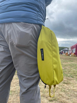 Ultralight Compact Camping Chair carry bag held at outdoor event