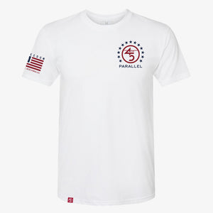 Freedom Star Badge Tee in Alpine White — front view with chest badge and sleeve flag