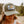 Load image into Gallery viewer, Woman wearing 45th Parallel Trout Patch Trucker hat in nature
